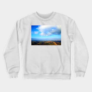 View from above on a hilly landscape under the blue sky with clouds Crewneck Sweatshirt